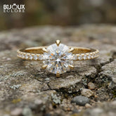Brilliant Round-Cut Diamond Engagement Ring with Sparkling Side Stones on a Classic Gold Band - Bijoux Eclore