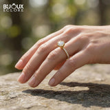 Brilliant Round-Cut Diamond Engagement Ring with Sparkling Side Stones on a Classic Gold Band - Bijoux Eclore