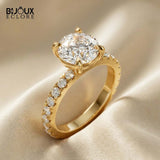 Round-Cut Diamond Engagement Ring with a Brilliant Gold Band and Sparkling Accents - Bijoux Eclore