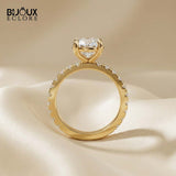Round-Cut Diamond Engagement Ring with a Brilliant Gold Band and Sparkling Accents - Bijoux Eclore