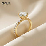 Round-Cut Diamond Engagement Ring with a Brilliant Gold Band and Sparkling Accents - Bijoux Eclore