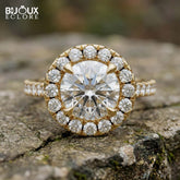 Brilliant Round Diamond Surrounded by Sparkling Side Stones on a Timeless Yellow Gold Band - Bijoux Eclore