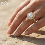 Brilliant Round Diamond Surrounded by Sparkling Side Stones on a Timeless Yellow Gold Band - Bijoux Eclore
