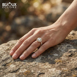 Brilliant Round Diamond Surrounded by Sparkling Side Stones on a Timeless Yellow Gold Band - Bijoux Eclore