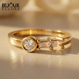 Sculptural Solid Gold Ring Showcasing a Radiant Round Centerpiece and a Parallel Duo of Precision-Cut Baguette Diamonds - Bijoux Eclore
