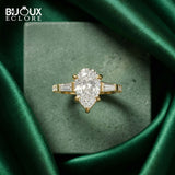 Luxury Pear Cut Diamond Ring with Tapered Baguette Side Stones in Polished Gold - Bijoux Eclore