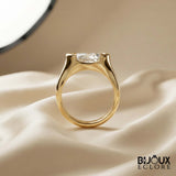 Oval-Cut Diamond Ring with a Sleek Gold Band and Innovative Setting - Bijoux Eclore