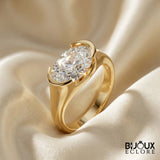 Oval-Cut Diamond Ring with a Sleek Gold Band and Innovative Setting - Bijoux Eclore