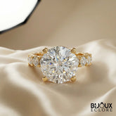 Round-Cut Diamond Engagement Ring with Side Stone Accents and a Luxurious Gold Band - Bijoux Eclore