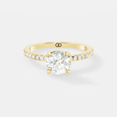 Exquisite Rose Gold Engagement Ring Featuring a Brilliant Round Cut Center Diamond and a Pavé Diamond - Bijoux Eclore