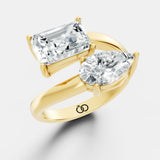 Stunning Dual-Diamond Ring Featuring Emerald and Pear Cut Stones in a Graceful Bypass Design - Bijoux Eclore