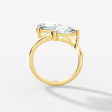 Stunning Dual-Diamond Ring Featuring Emerald and Pear Cut Stones in a Graceful Bypass Design - Bijoux Eclore