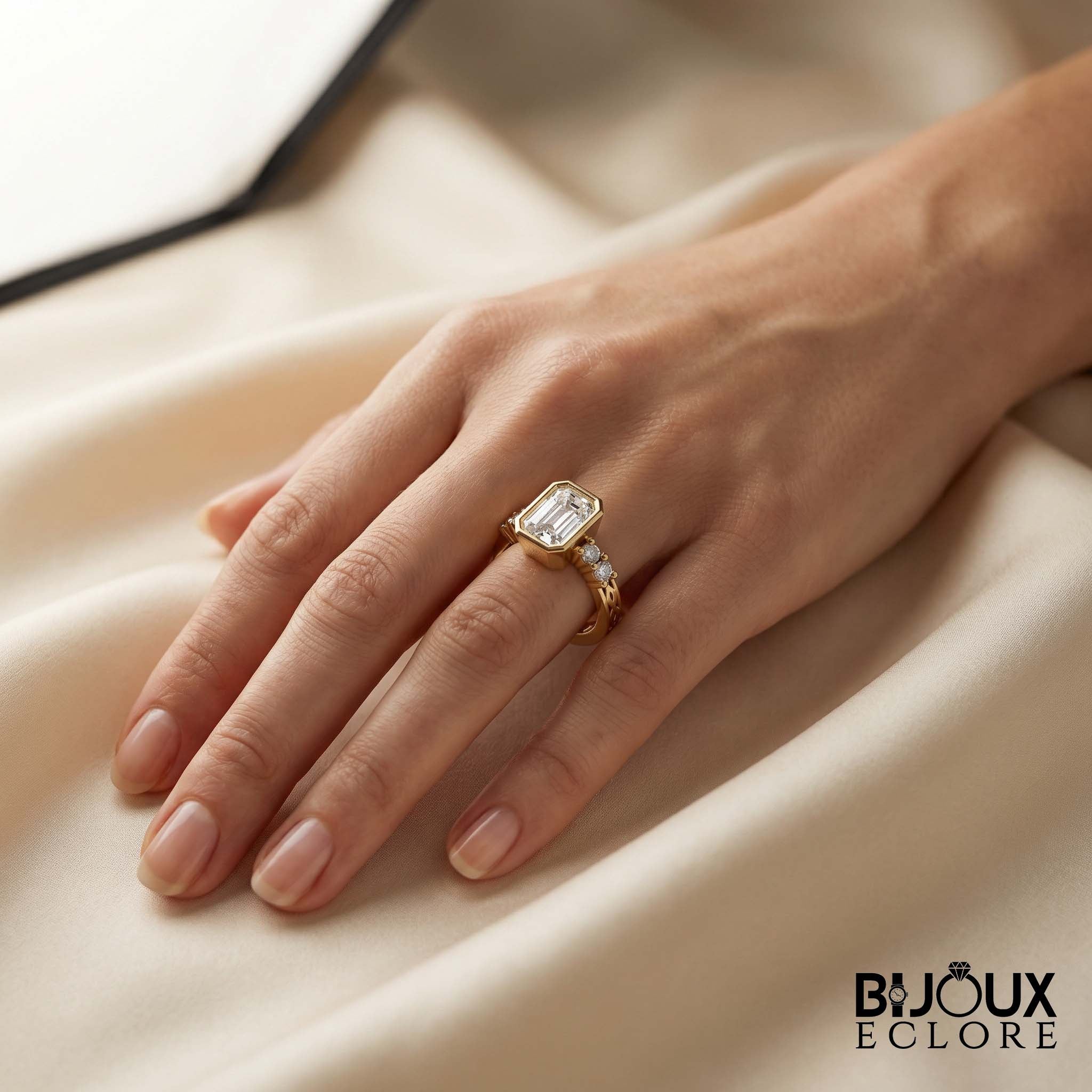 Diamond Ring with an Emerald-Cut Centerpiece and Timeless Gold Detailing - Bijoux Eclore