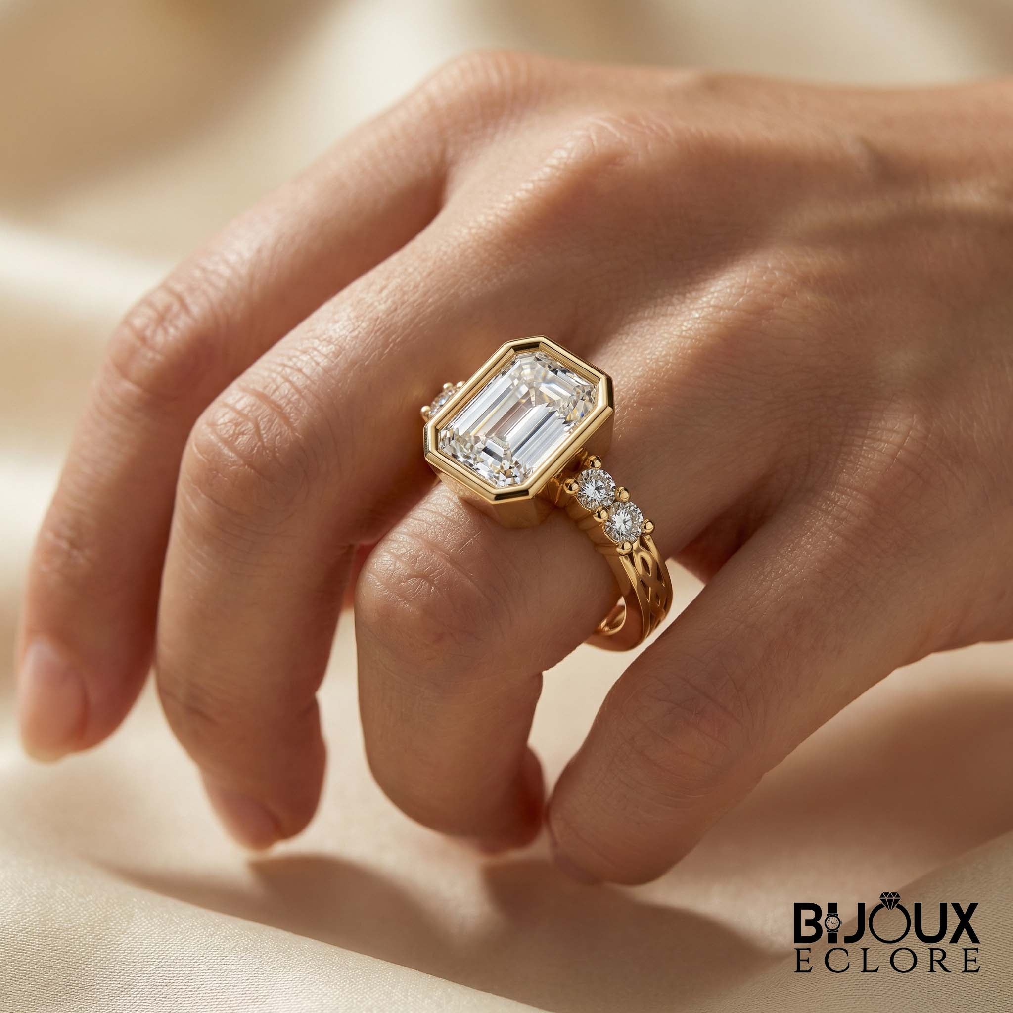 Diamond Ring with an Emerald-Cut Centerpiece and Timeless Gold Detailing - Bijoux Eclore
