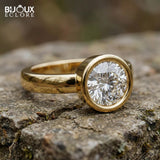 Round-Cut Diamond Surrounded by a Polished Gold Bezel on a Simple, Elegant Band - Bijoux Eclore