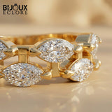 Avant-Garde Double-Stacked Ring Showcasing Parallel Rows of Precision-Cut Diamonds Held by Sculptural Golden Prongs - Bijoux Eclore