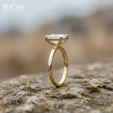 Emerald-Cut Diamond Set in a Classic Yellow Gold Band for a Refined and Elegant Look - Bijoux Eclore