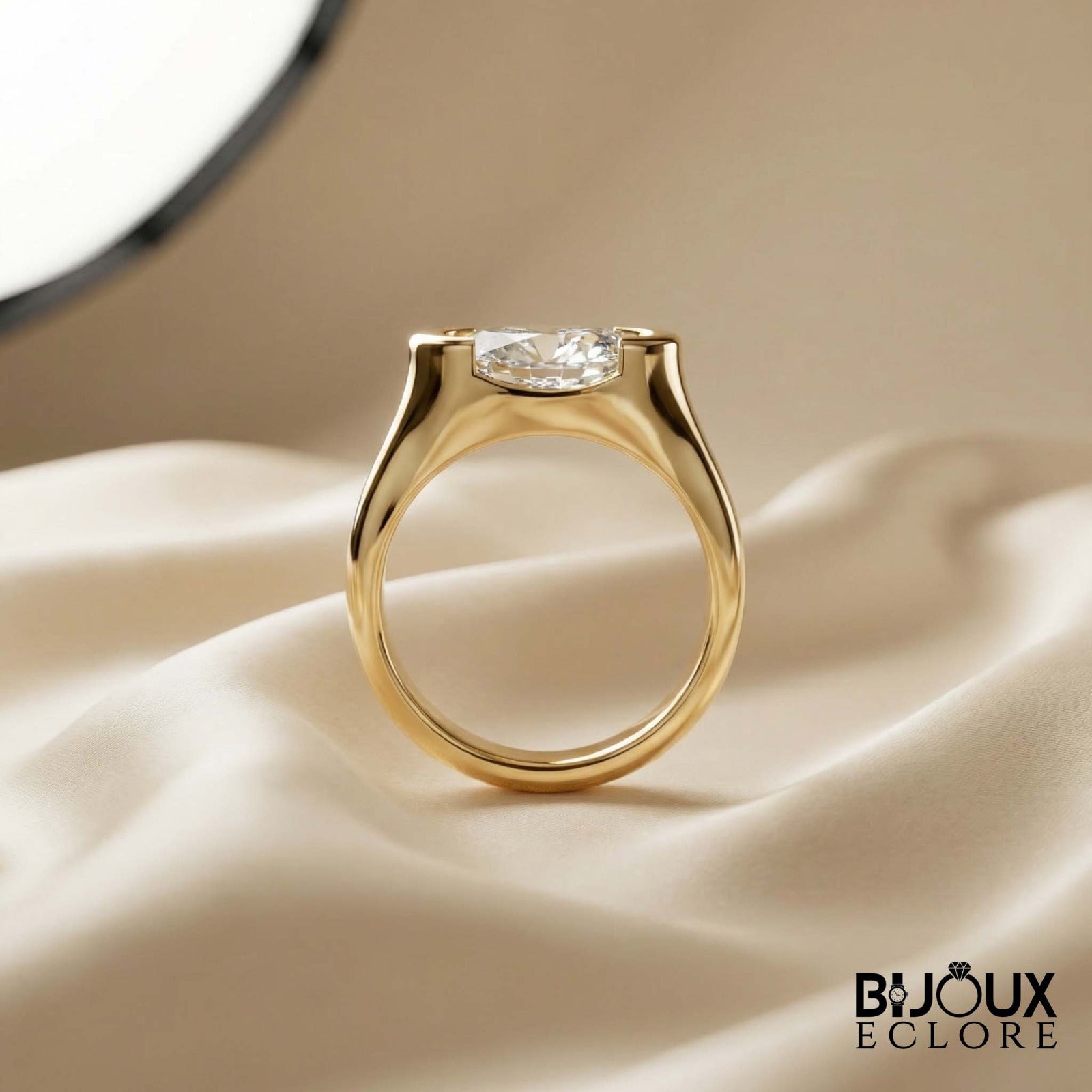 Oval-Cut Diamond Ring with a Sleek Gold Band and Innovative Setting - Bijoux Eclore