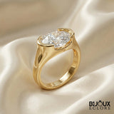 Oval-Cut Diamond Ring with a Sleek Gold Band and Innovative Setting - Bijoux Eclore
