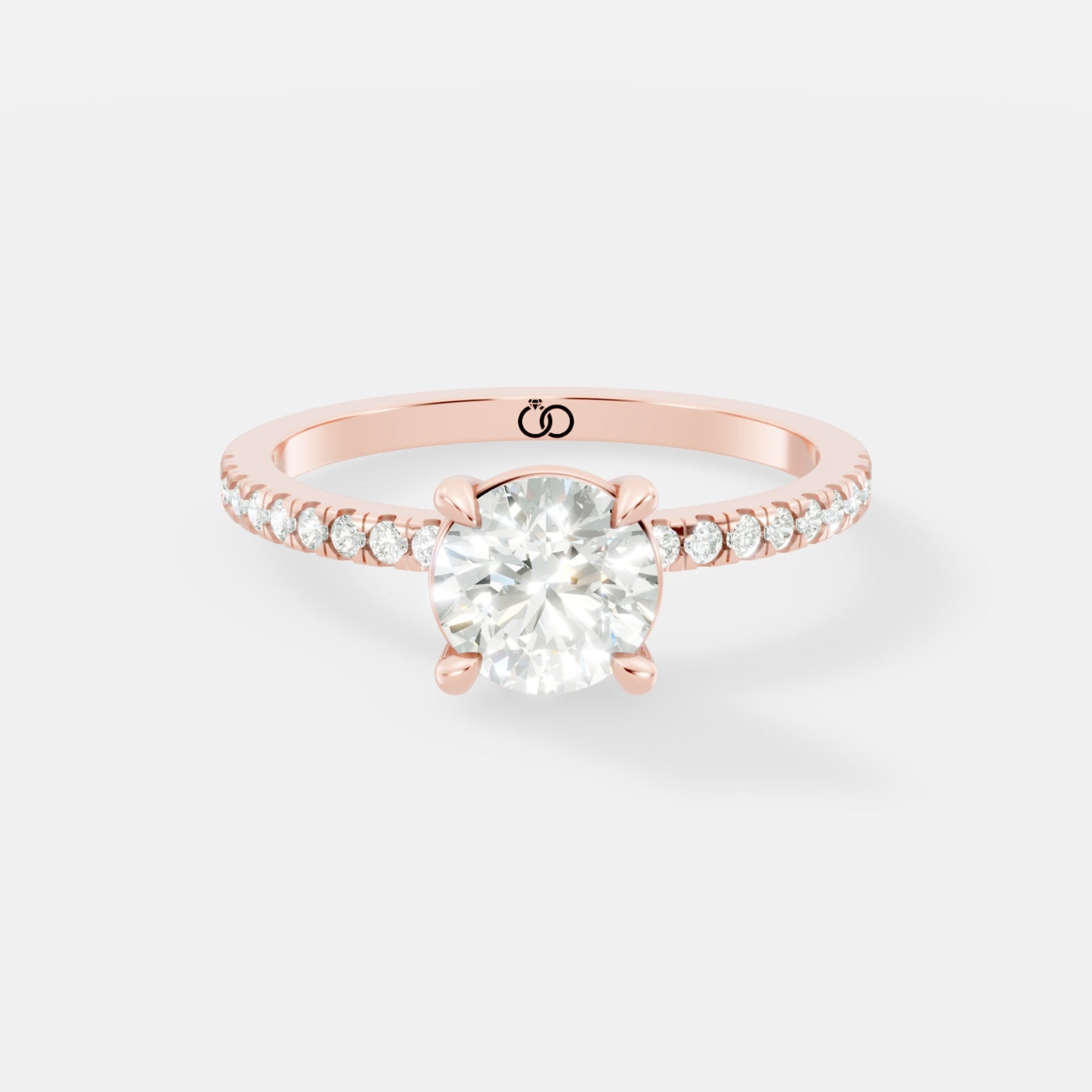 Exquisite Rose Gold Engagement Ring Featuring a Brilliant Round Cut Center Diamond and a Pavé Diamond - Bijoux Eclore