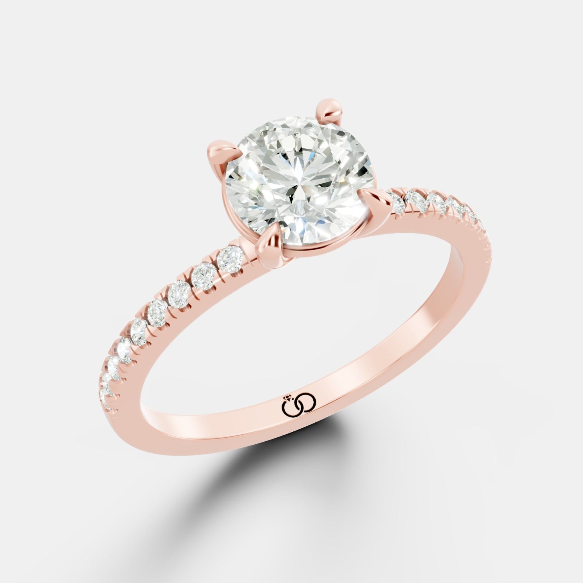 Exquisite Rose Gold Engagement Ring Featuring a Brilliant Round Cut Center Diamond and a Pavé Diamond - Bijoux Eclore