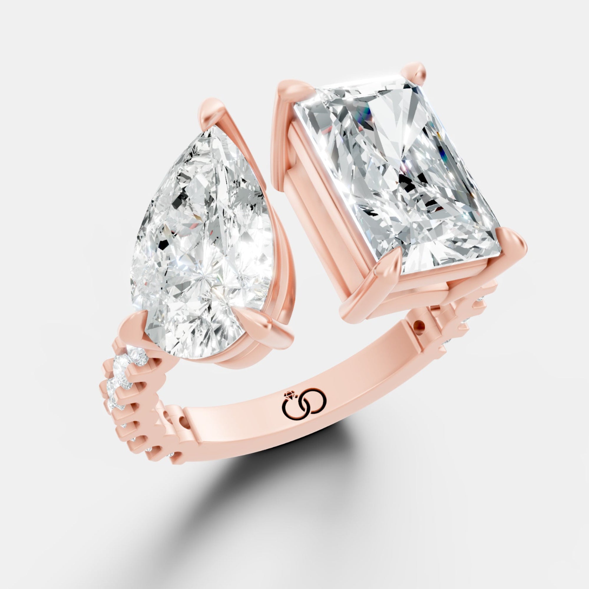 Exquisite Two-Stone Gold Ring Featuring a Pear-Cut and Emerald-Cut Diamond with Delicate Pavé - Bijoux Eclore