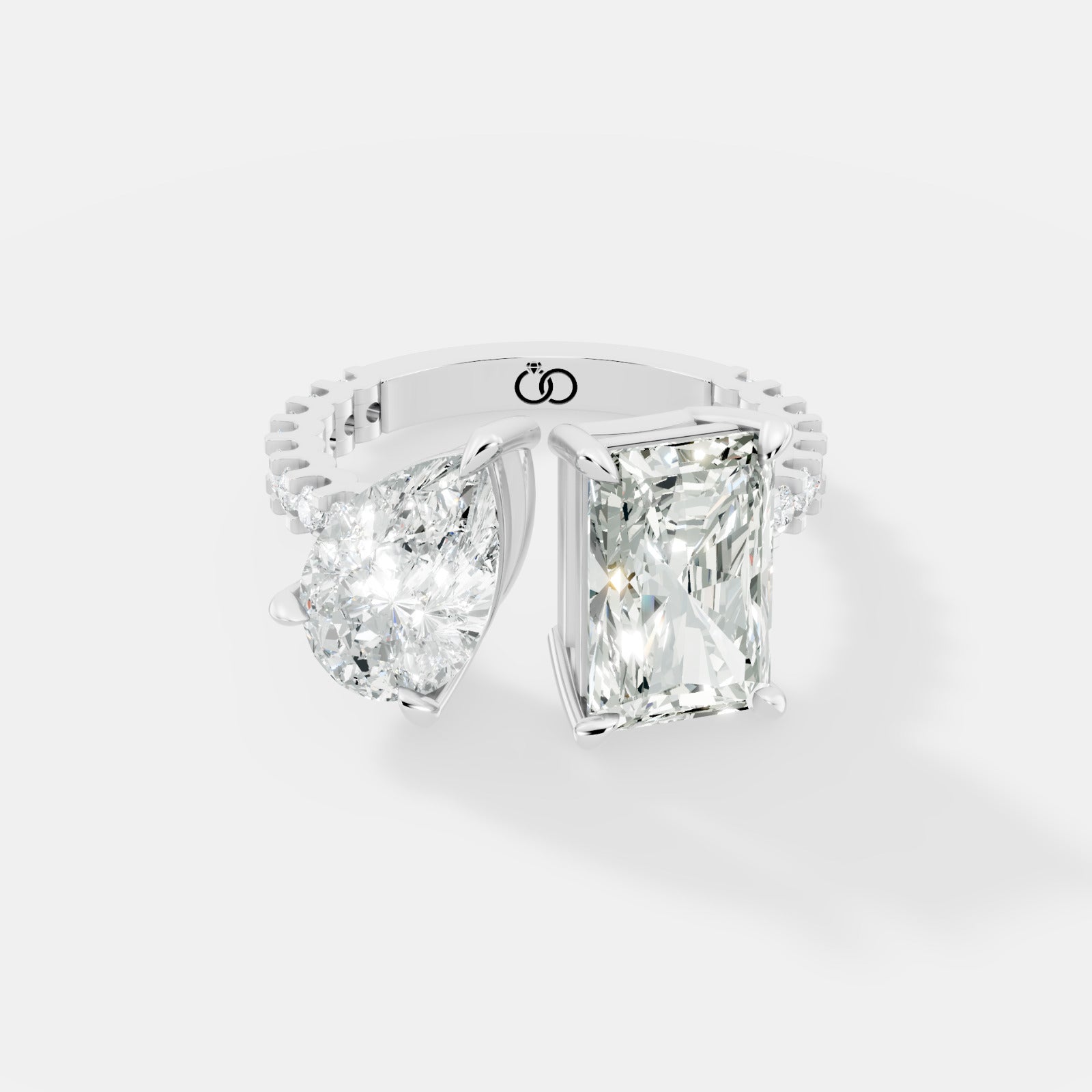 Exquisite Two-Stone Gold Ring Featuring a Pear-Cut and Emerald-Cut Diamond with Delicate Pavé - Bijoux Eclore